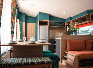 The living and dining area of our bright and spacious Exclusive accommodation, The Burst of Blue. The perfect way to stay. image
