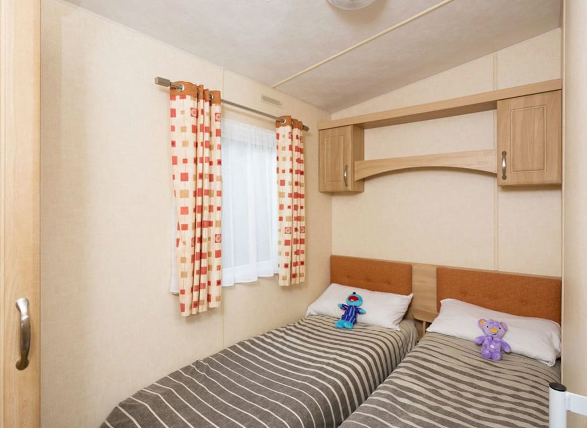 The twin bedroom of our accessibility adapted static caravans. The perfect way to stay. image