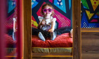 A young girl enjoying herself in The Rockstar, Book your holiday now! image
