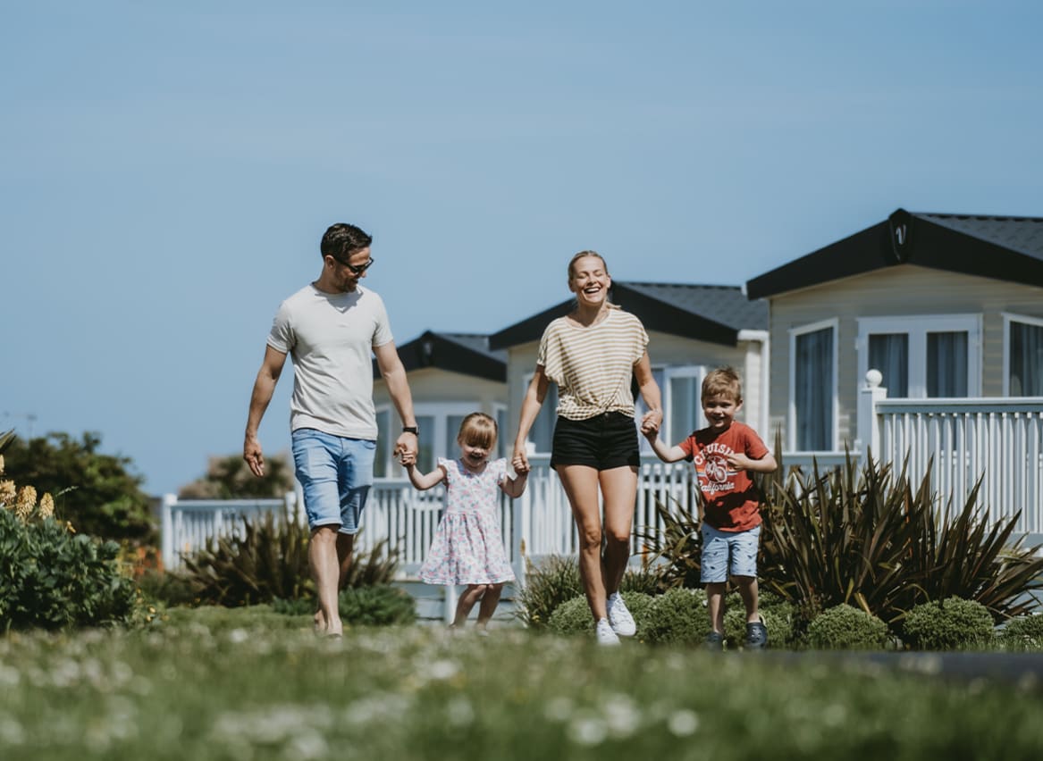 Family walking through our Newquay Bay Holiday Park. image