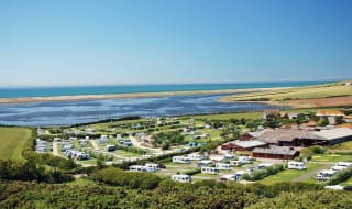 A drone image of our camping and touring park in Dorset, East Fleet Farm with views of the lagoon. image