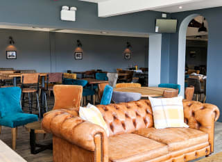 The seating area at our on-site restaurant at Bude Holiday Resort. image