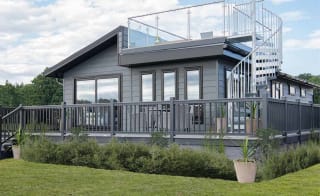 The exterior of our stunning Luxury Lodge with a roof terrace at Swanage Bay View, Dorset. Book your holiday now! image
