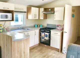 The kitchen area of our bright and spacious superior static caravan. The perfect way to stay. image