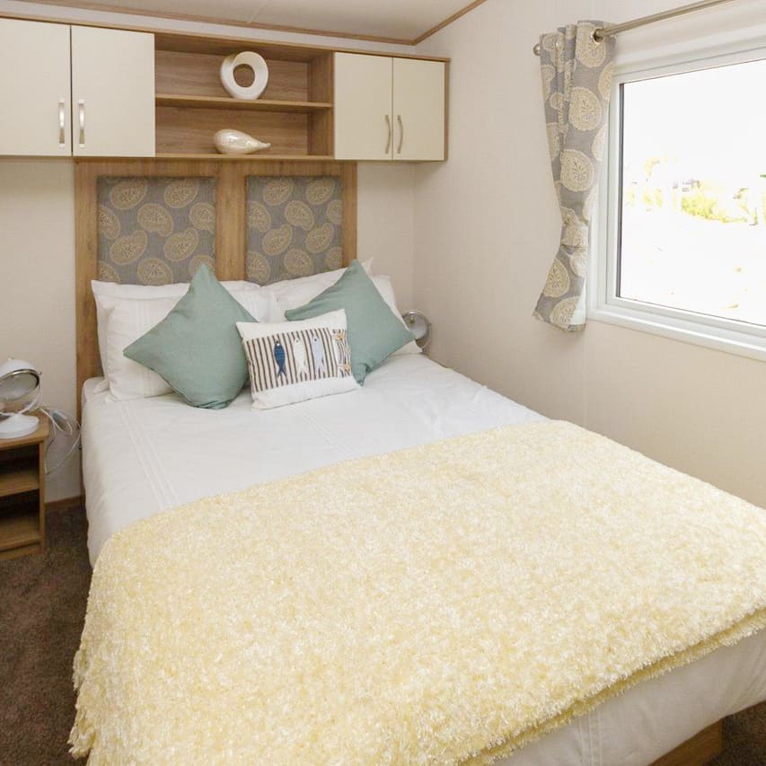 The double bedroom of our bright and spacious luxury static caravan. The perfect way to stay.
