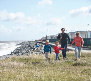 A family walking in our Golden Sands holiday park. image