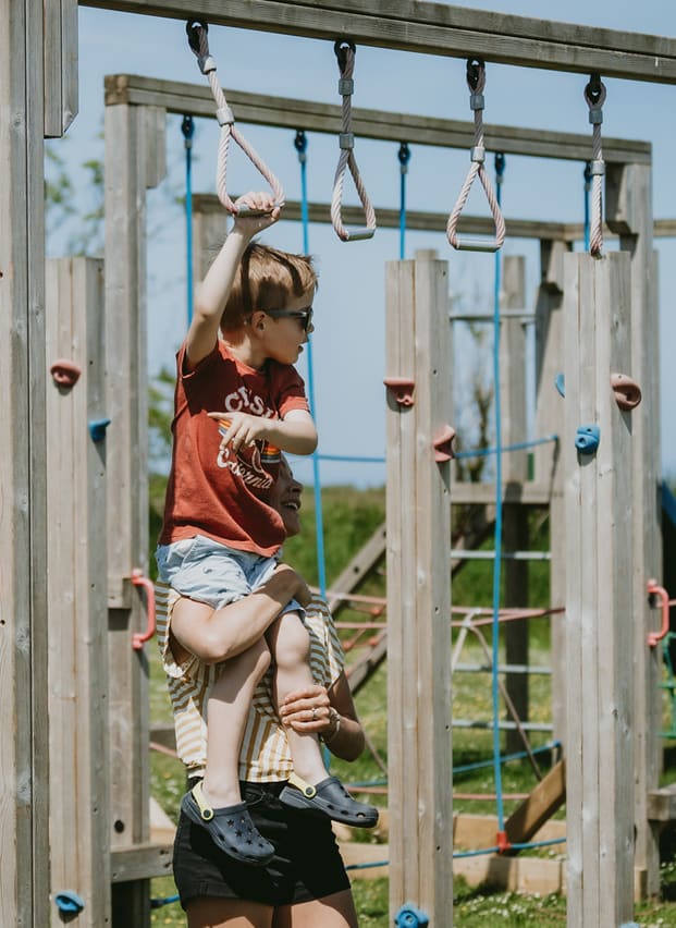 A child playing in the park at Newperran, Cornwall.