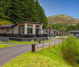 Our Glendevon holiday park. There are many luxury lodges in the area, with large hills and woodland surrounding the park.