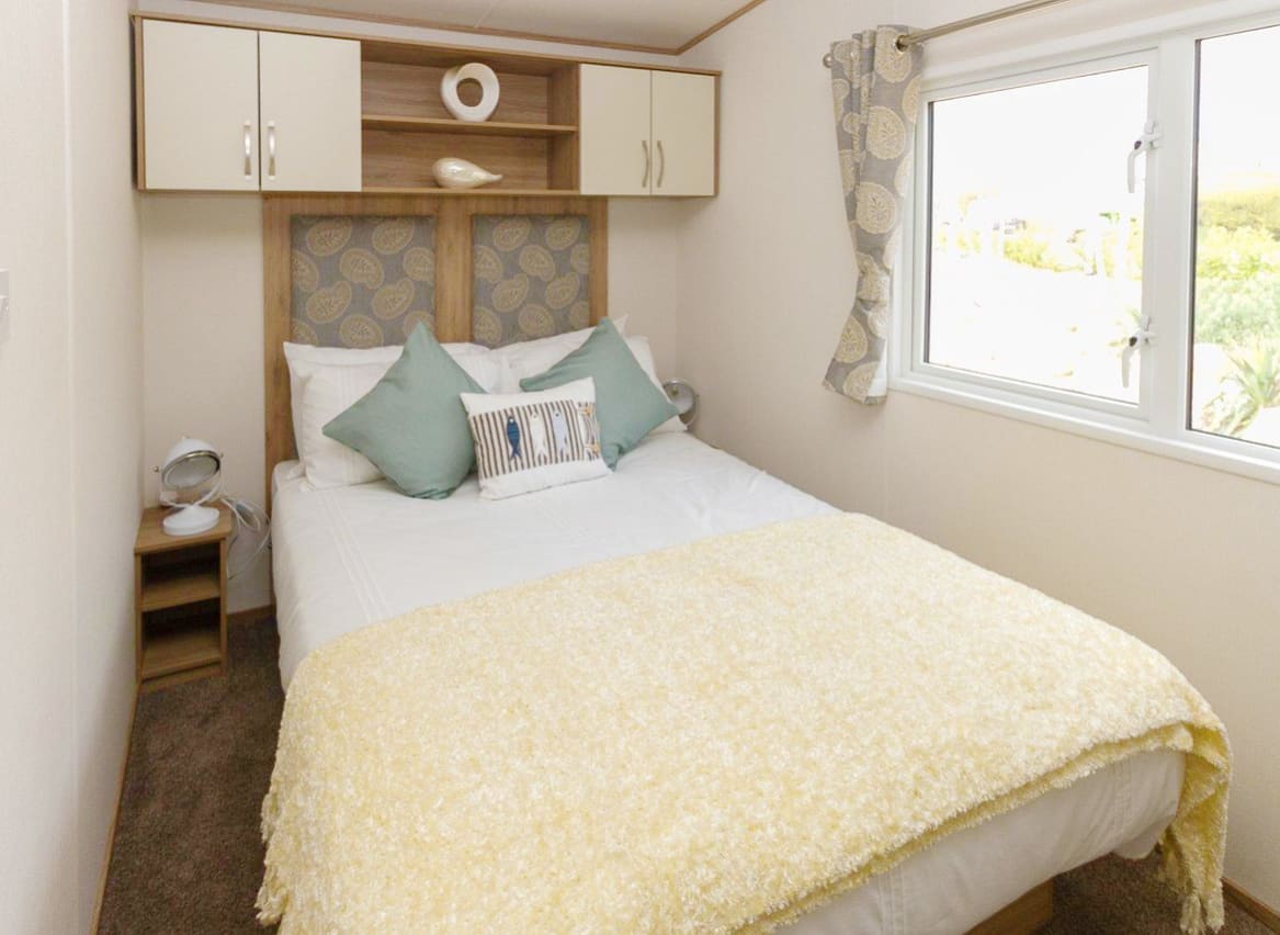 The double bedroom of our bright and spacious luxury static caravan. The perfect way to stay. image