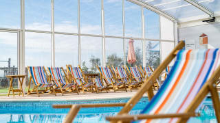 A close up image of a deck chair inside our indoor swimming pool at Mersea Island.