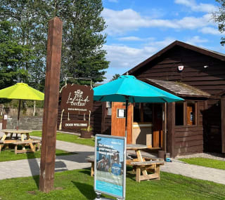 The exterior of the Lakeside Tavern at Moffat Manor Holiday Park on a summers day. image
