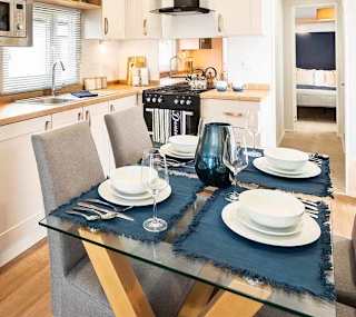The kitchen and dining area of our bright and spacious luxury static caravan. The perfect way to stay. image
