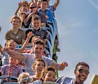 A group of people on a rollercoaster at The BIG Sheep.