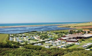 A drone image of our camping and touring park in Dorset, East Fleet Farm with views of the lagoon. image