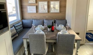 The dining area of one of our spacious static caravans in St Ives. Book your holiday now! image