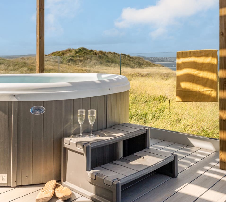 A bright sunny day at our St Ives park with stunning views from our hot tubs. image