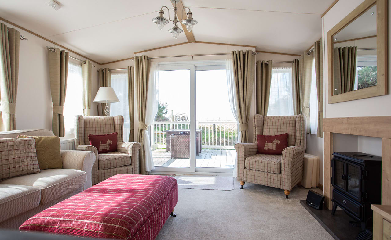 The lounge area of our bright and spacious indulgent static caravan. The perfect way to stay. image