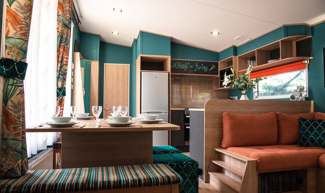 The living and dining area of our bright and spacious Exclusive accommodation, The Burst of Blue. The perfect way to stay. image