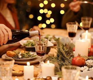 A close up of people enjoying a Christmas dinner