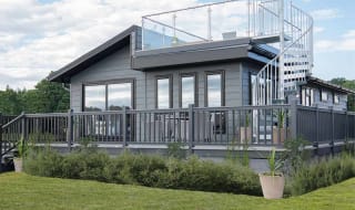 The exterior of our stunning Luxury Lodge with a roof terrace at Swanage Bay View, Dorset. Book your holiday now! image