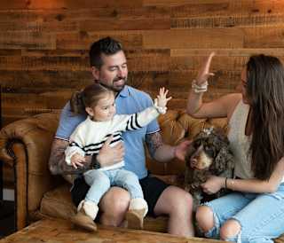 A family enjoying an afternoon at The Lookout Bar & Eatery at Retallack Resort, Cornwall.