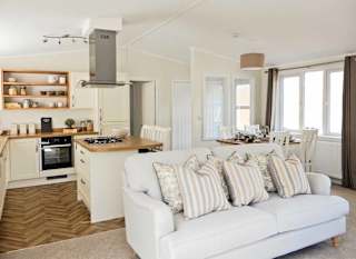 The lounge and kitchen area of one of our lodges at our holiday resort in Cornwall, Newperran. image