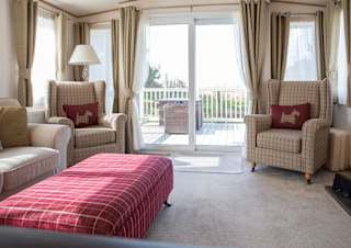 The lounge area of our bright and spacious indulgent static caravan. The perfect way to stay.