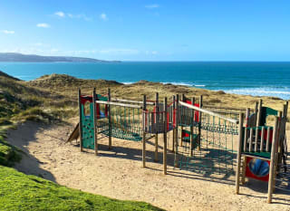 The outdoor playground on the beach at our St Ives Bay Holiday Park with views of the sea. image