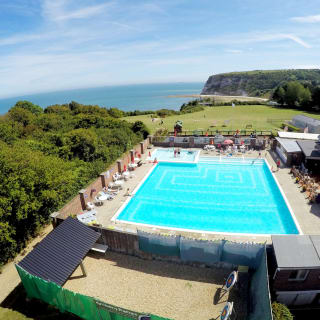 A hot summer's day overlooking our outdoor pool at Whitecliff Bay. Come see for yourself when you visit the Isle of Wight on your next caravan holiday.
