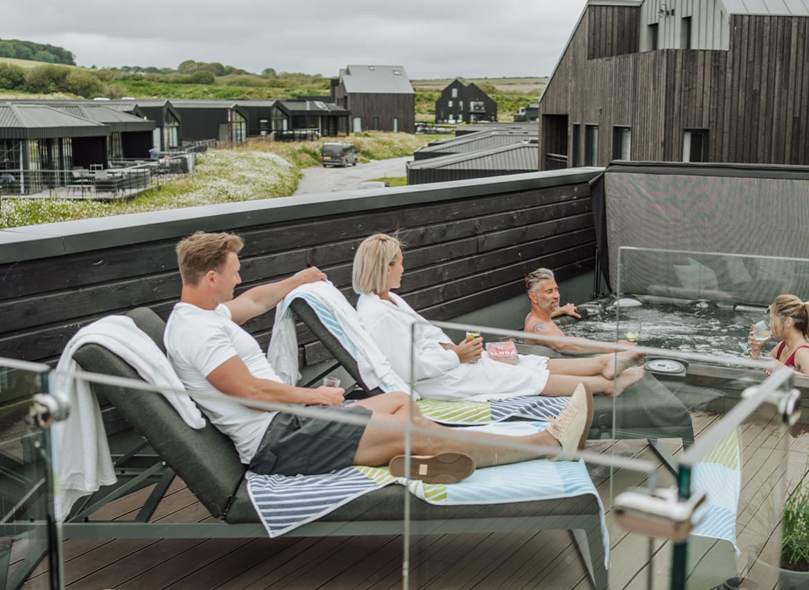 Friends chilling in the rooftop hot tub at Retallack Resort and spa. image