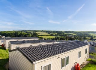 An exterior shot of our beautiful caravans featuring the stunning Isle of Wight views. image