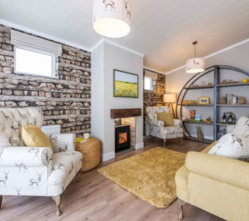 The lounge area of our bright and spacious luxury rooftop lodge at Swanage Bay View. The perfect way to stay. image