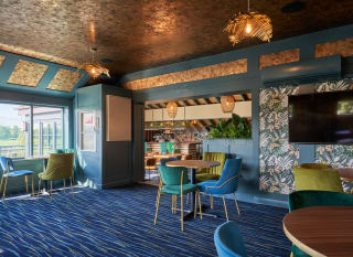 Seating area inside the Tipsy Eagle Bar at Appletree Holiday Park. image