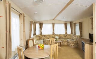 The living and dining area of our accessibility adapted static caravan. The perfect way to stay. image