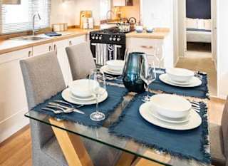 The kitchen and dining area of our bright and spacious luxury static caravan. The perfect way to stay. image