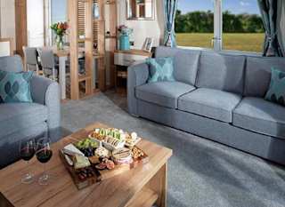 The lounge area of our bright and spacious luxury static caravan at St Helens holiday park. The perfect way to stay. image