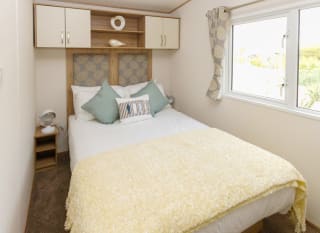 The double bedroom of our bright and spacious luxury static caravan. The perfect way to stay. image