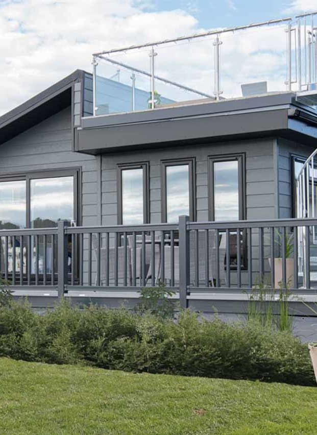 The exterior of our stunning Luxury Lodge with a roof terrace at Swanage Bay View, Dorset. Book your holiday now!