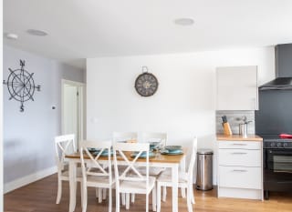 The dining area of one of our spacious static caravans at Mersea Island. Book your holiday now! image