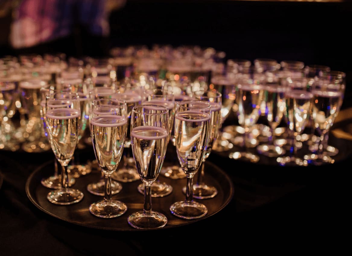 Prosecco glasses available for guests at a corporate event. image