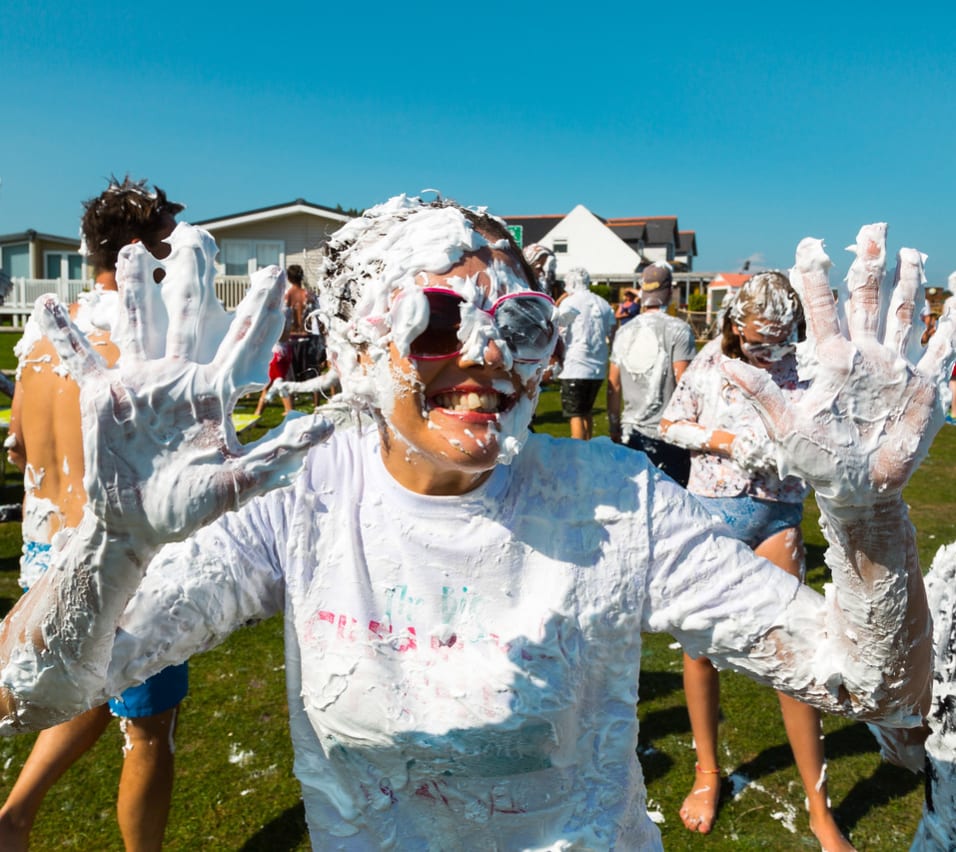 A hot summer day with a group of people covered in custard pie! As part of the many events and activities we offer at our holiday parks. image