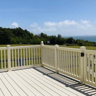 The decking area on a sunny day at one of our exclusive accommodations, The Seaview Lodge. Book your holiday now!