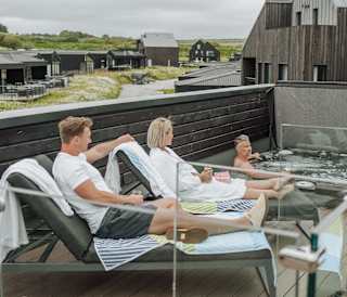 Friends chilling in the rooftop hot tub at Retallack Resort and spa.