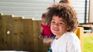 A young child playing near a holiday home hot tub.