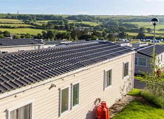 An exterior shot of our beautiful caravans featuring the stunning Isle of Wight views. image