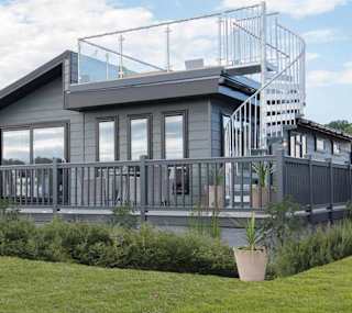 The exterior of our stunning Luxury Lodge with a roof terrace at Swanage Bay View, Dorset. Book your holiday now! image