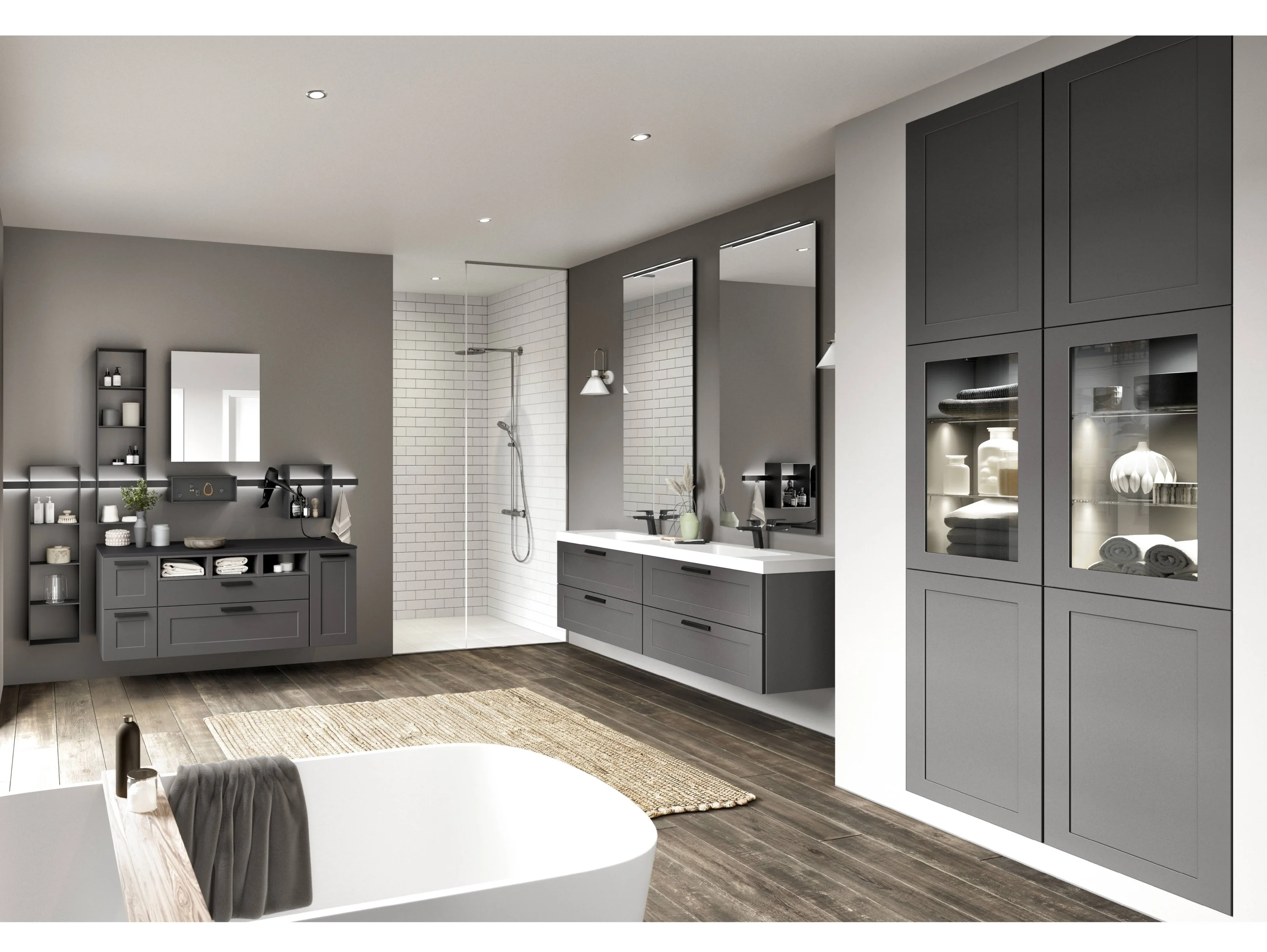 Graues Badezimmer mit weissem Waschtisch und zwei hohen Spiegeln. Hohe Einbauschränke und ein Highboard extra - Seitenansicht