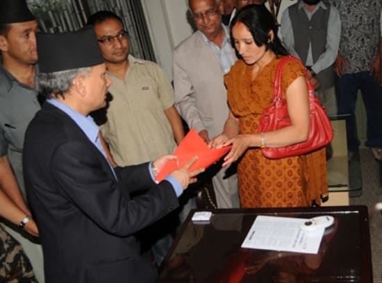 Baburam Bhattarai listening to Amar Bahadur Bam's Wife