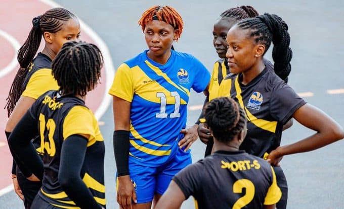 Sport-S women's volleyball players in a team huddle during the National Club Volleyball Championship