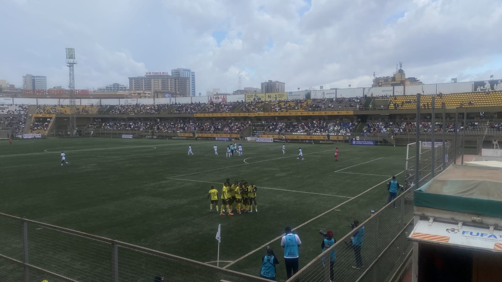 Crested Cranes players gather on the pitch